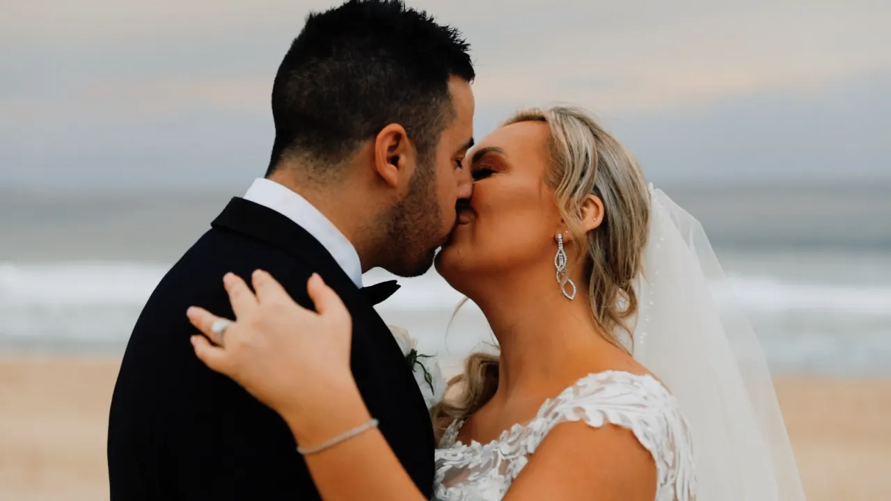 Renee & Simon at City Beach Wollongong, wedding film frame 5