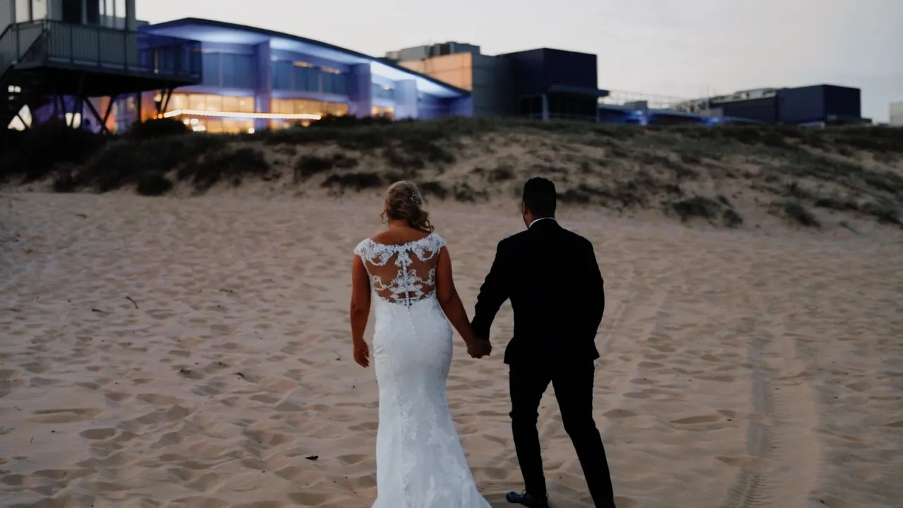 Renee & Simon at City Beach Wollongong, wedding film frame 21